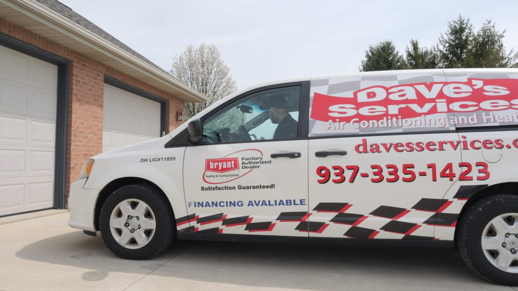 Dave’s Services branded vehicle parked in front of a residential home, representing a trusted HVAC company providing expert heating, furnace, heater, AC, air conditioning, air conditioner, cooling, heat pump, and indoor air quality services, including repair, maintenance, and installation for homes in Troy, Tipp City, Piqua, Vandalia, West Milton, and Pleasant Hill. Call us now for help with HVAC company, local HVAC company near me, heating repair, heater service, furnace repair, furnace maintenance, AC repair, air conditioner repair, air conditioning service, air conditioning maintenance, cooling system repair, heat pump repair, heat pump maintenance, HVAC maintenance, HVAC installation, HVAC repair near me, emergency HVAC service, residential HVAC services, commercial HVAC services, indoor air quality solutions, Bryant HVAC dealer, professional HVAC technicians, reliable heating and cooling service, energy-efficient HVAC installation, ductless HVAC service, seasonal HVAC tune-up, trusted HVAC contractors, local heating and cooling experts, AC service near me, furnace service near me, heat pump service near me, HVAC inspection near me.